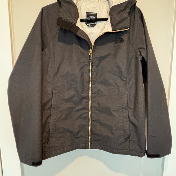 The North Face Jackets & Blazers - The North Face Charcoal Gray Rain Parka with gold zipper.
